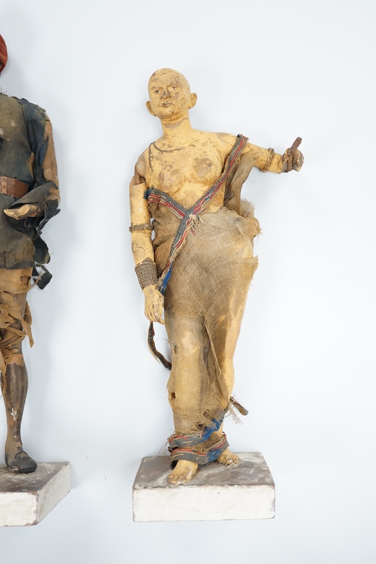 Two Indian clay figures, 26cm high